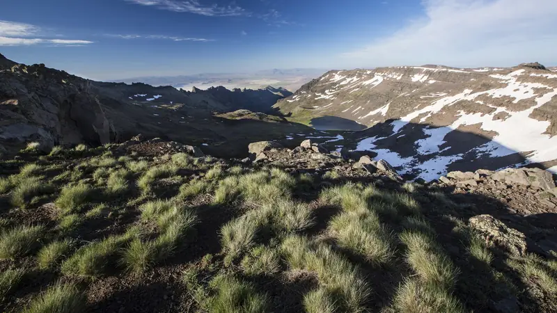 Illustrative photo: Snow on rocky high country above bunchgrass on Steens Mountain